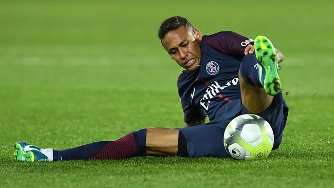 Paris Saint-Germain's Brazilian forward Neymar falls.