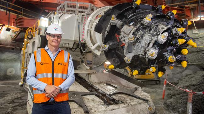 State Library Station construction manager Andrew Bank with one of the road headers being used today. Picture: Jay Town