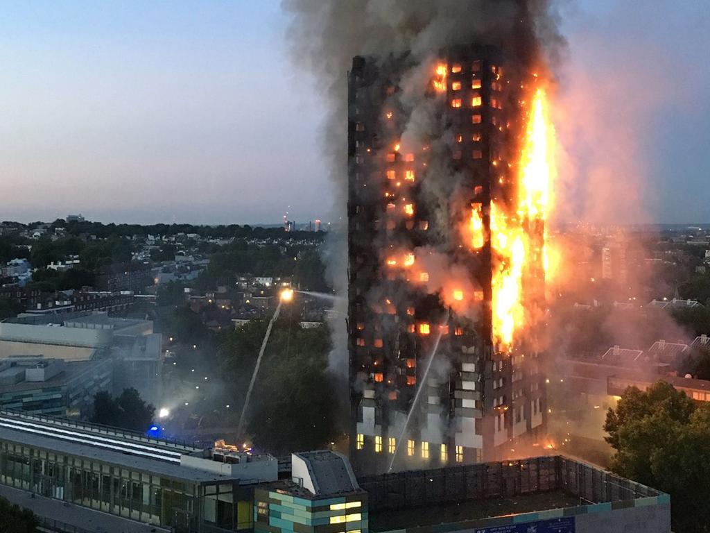 A handout image given to local resident Natalie Oxford early on June 14, 2017 shows flames and smoke coming from a 27-storey block of flats after a fire broke out in west London. The fire brigade said 40 fire engines and 200 firefighters had been called to the blaze in Grenfell Tower, which has 120 flats. Picture: AFP PHOTO/Natalie Oxford