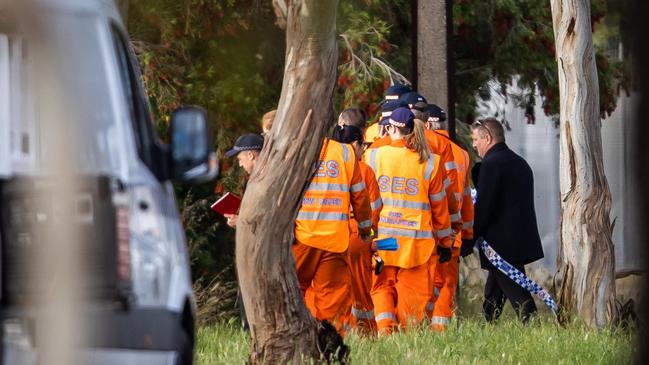 SES volunteers search the scene for more evidence. Picture: Tom Huntley