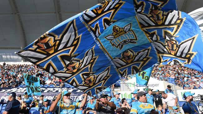 Titans fans are seen during the game against the New Zealand Warriors. (AAP Image/Dave Hunt).