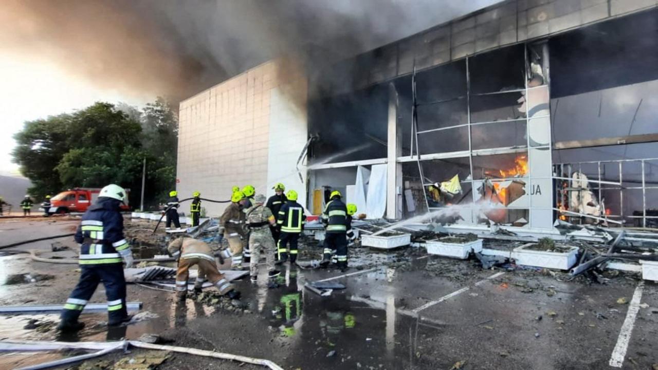 Firefighters putting out the fire in a mall hit by a Russian missile strike in the eastern Ukrainian city of Kremenchuk. Picture: AFP