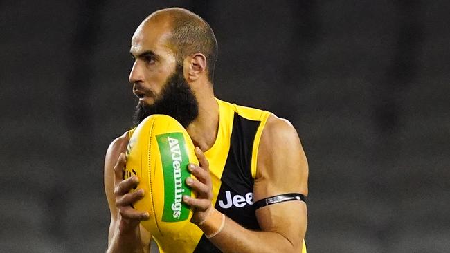 Bachar Houli of the Tigers runs with the ball during the Round 4 AFL match between the St Kilda Saints and the Richmond Tigers at Marvel Stadium in Melbourne, Saturday, June 27, 2020. (AAP Image/Scott Barbour) NO ARCHIVING, EDITORIAL USE ONLY