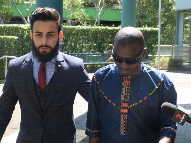 Ibrahim Bangura (right), 43, of Chester Hill, leaving Gosford Local Court with a solicitor after his first appearance in January. Picture: Richard Noone