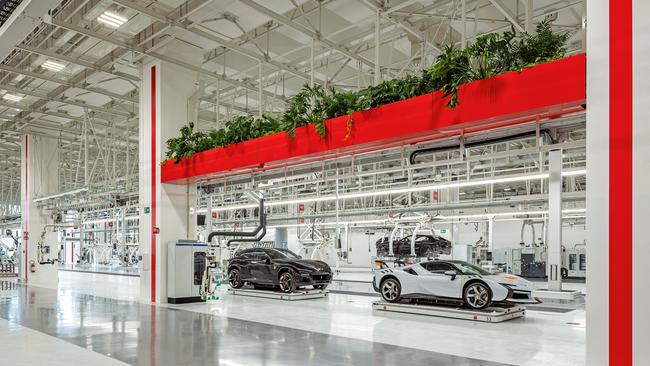 Clever use of light and reflective surfaces transforms Ferrari’s production floor into a facility that appears more like an exhibition space than a factory. Picture: Duccio Malagamba