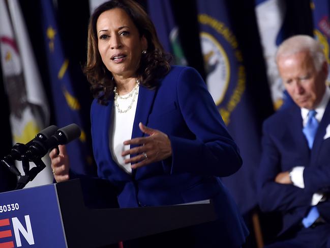 Joe Biden listens to Kamala Harris. Picture: AFP