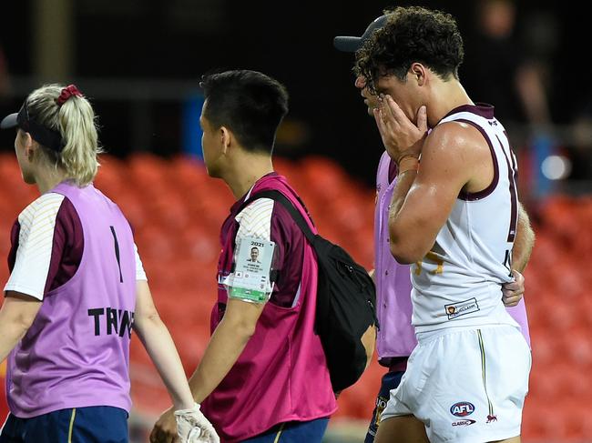 A distraught Cam Rayner leaves the field and with serious concerns about his season.