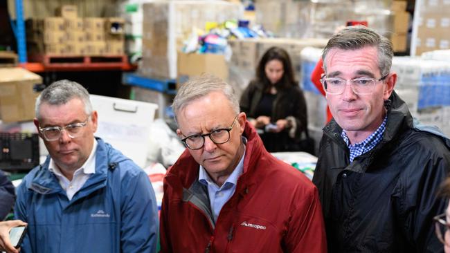 Federal Minister for Emergency Management Murray Watt, Prime Minister Anthony Albanese and NSW Premier Dominic Perrottet meeting volunteers and flood victims at Hawkesbury's Helping Hands, Windsor, Sydney. Picture: NCA NewsWire / James Gourley