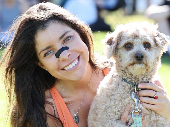 The Daily Telegraph 25.4.2025 Constanza Tirado-Subiabe at Bondi Beach tries a nose strip that is said to help breathing..  Picture: Rohan Kelly