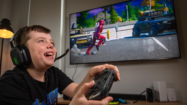 Parents are encouraged to familiarise themselves with their childrens video games as there are some settings that can dial down gore or prevent in-game spending. Picture: Jason Edwards