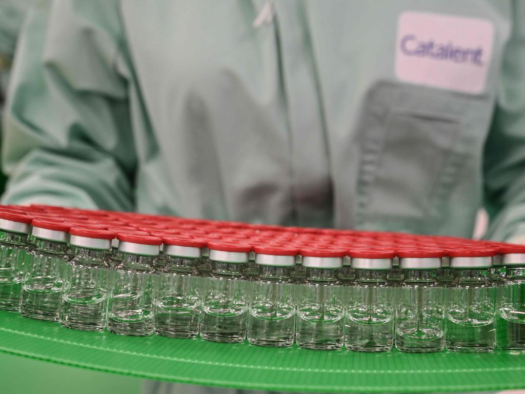 A laboratory technician handles capped vials as part of filling and packaging tests for the large-scale production and supply of the University of Oxford’s COVID-19 vaccine candidate, AZD1222. Picture: Vincenzo Pinto