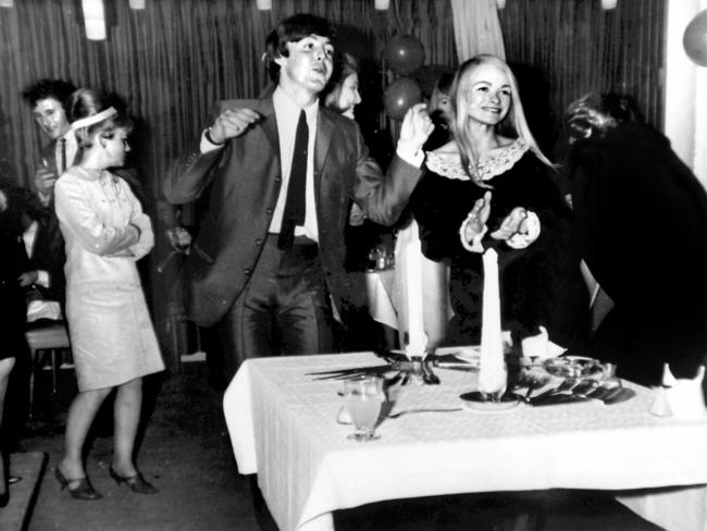 McCartney celebrates his birthday in Sydney with Delphine Morrisey (R) and other fans during their Australian tour in 1964.