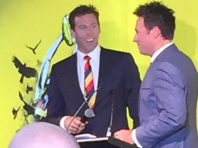 Grant Hackett is interviewed by Troy Gray on Saturday night at Adelaide Oval for a function during the Adelaide Crows-versus-Sydney Swans match.