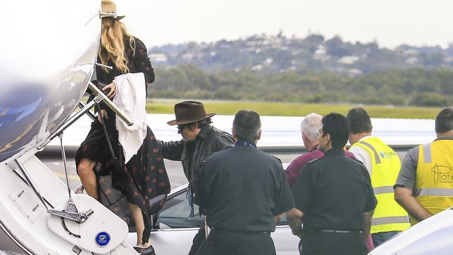 Johnny Depp and Amber Heard board a private charter flight at Gold Coast Airport. The couple are heading home to Los Angeles to reunite with their pooches Pistol and Boo. Photo: ©MEDIA-MODE.COM