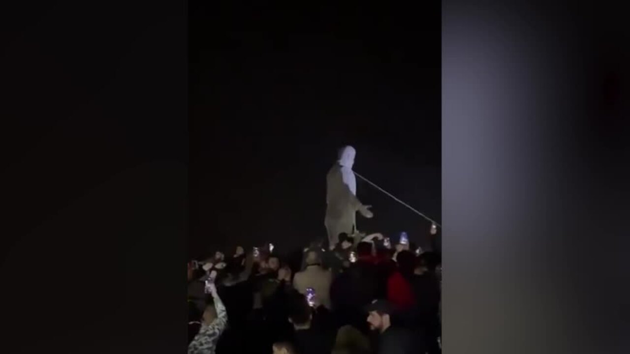 Statue of former Syrian president Hafez al-Assad toppled in Homs