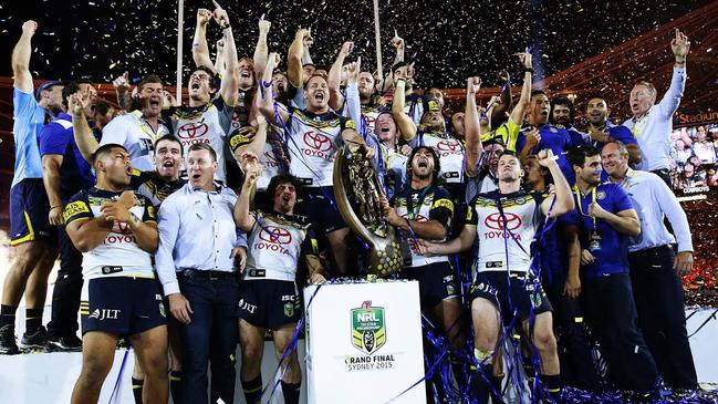 The Cowboys celebrate on the podium after winning the 2015 NRL grand final at ANZ Stadium. Picture: Brett Costello