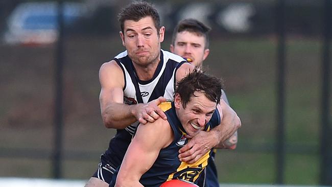 Matt Dennis tackles Ryan Jackson. Picture: Josie Hayden