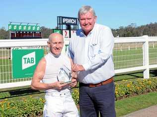 FAREWELL: Jockey Jeff Lloyd is thanked by Ipswich Turf Club chairman Wayne Patch after his final ride at the Bundamba track.