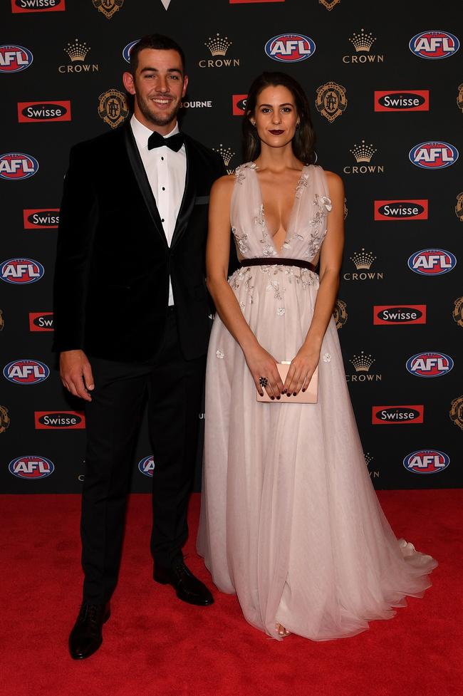 Taylor Walker of Adelaide and partner Ellie Brown. Picture: AAP