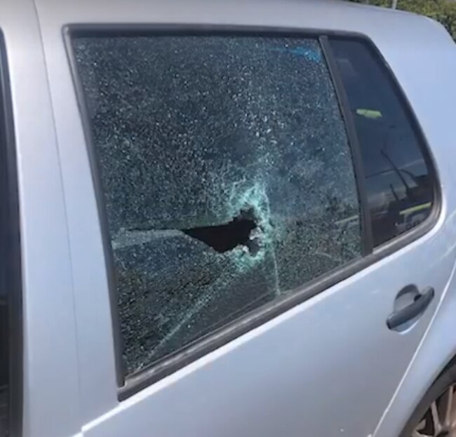 A three-year-old boy was lucky to escape when his head smashed this hole in a window after he was thrown from his child's seat. Source: Victoria Police