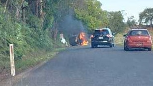 The car fire after the crash north of Murwillumbah this afternoon. Picture: Facebook.