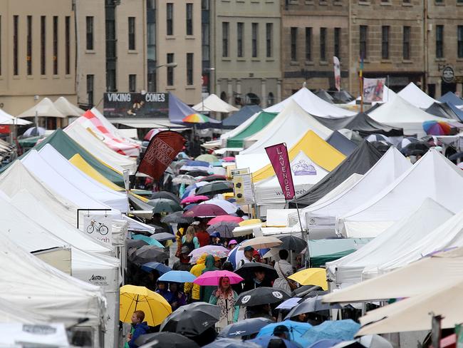 A sea of umbrellas looks likely at Hobart’s Salamanca Market over the weekend. Picture: Sam Rosewarne