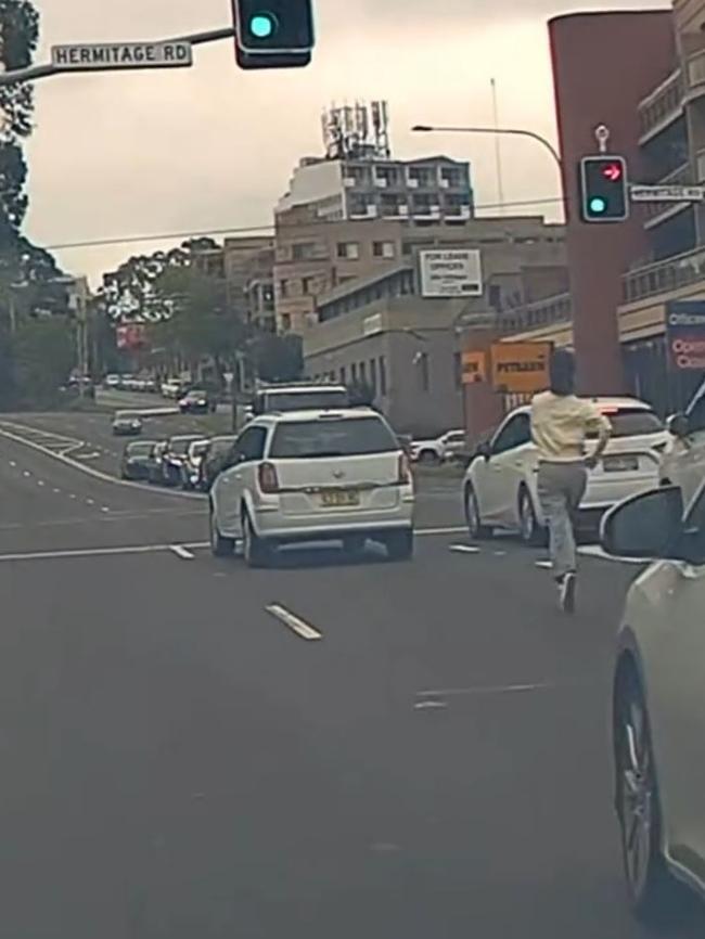 A driver who was on his way to work captured the moment a woman gave chase to assist the driver of a white Honda Civic who was suffering from a medical emergency. Picture: Instagram