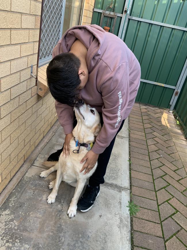 Anjali Habel-Orrell's son Matthew with dog Jadzia – but they have had to give their pet away. Picture: Supplied