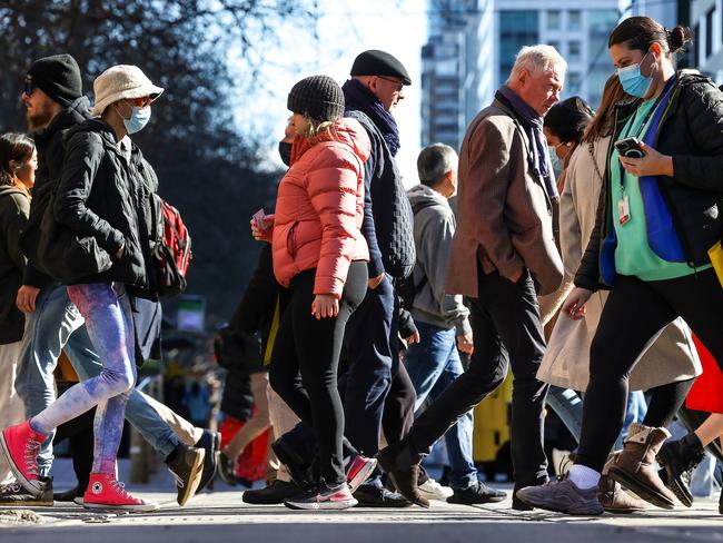 MELBOURNE, AUSTRALIA - NewsWire Photos AUGUST 25, 2022 : Elizabeth Street in the CBD at times can be a haven for the homeless. People cross between Elizabeth St and Flinders St.Picture NCA NewsWire / Ian Currie