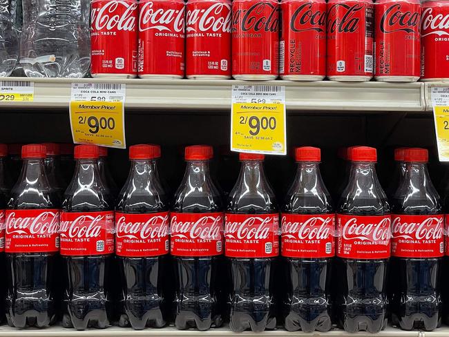 CORTE MADERA, CALIFORNIA - APRIL 24: Bottles of Coca Cola displayed at a grocery store on April 24, 2023 in Corte Madera, California. Coca Cola reported first quarter earnings that beat analyst expectations with revenues of $10.96 billion compared to the expected $10.8 billion.   Justin Sullivan/Getty Images/AFP (Photo by JUSTIN SULLIVAN / GETTY IMAGES NORTH AMERICA / Getty Images via AFP)