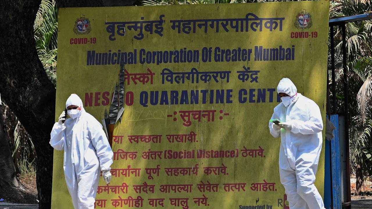 Health workers at a coronavirus quarantine centre following restrictions imposed in Mumbai on Monday. Picture: Indranil Mukherjee/AFP