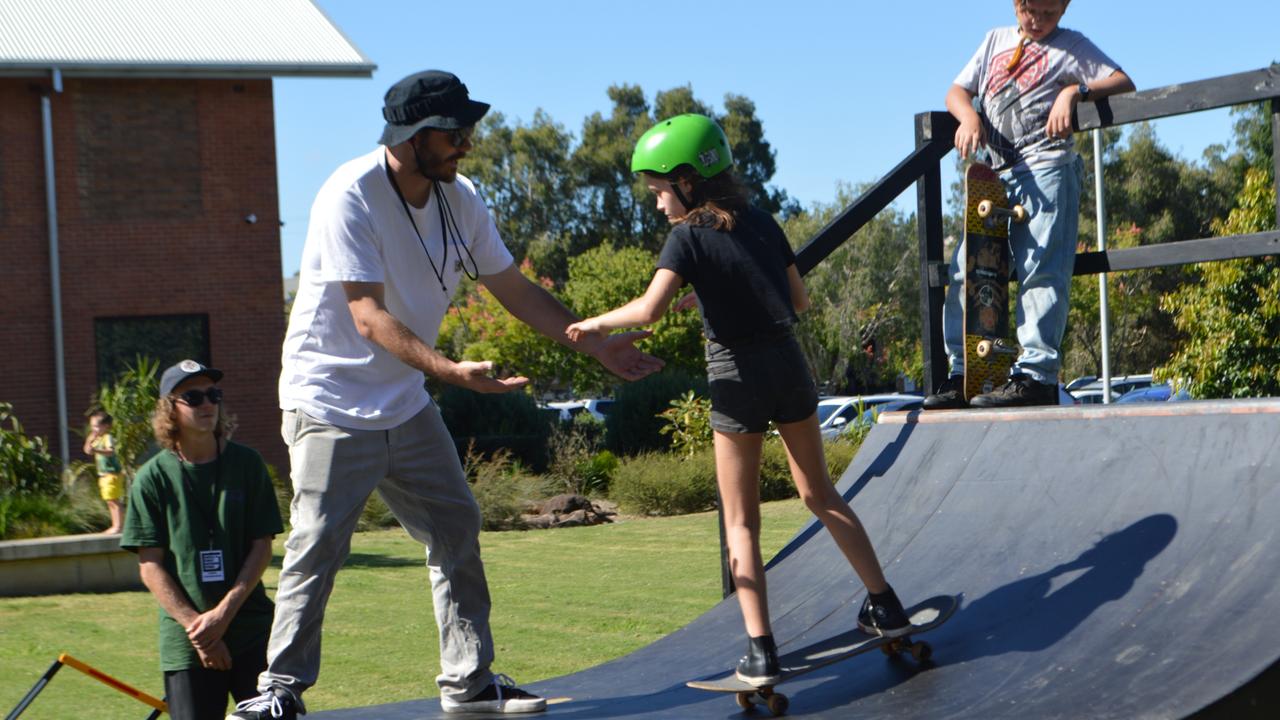 Young skaters take on the half pipe at the Lismore Quad.