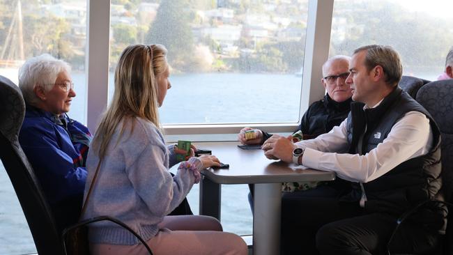 Transport Minister Michael Ferguson speaks to Derwent Ferry passengers