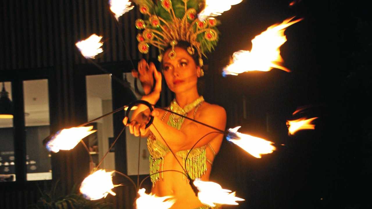 Fire dancer Sasha at AVID Property Group's launch of its new sales and information centre in Palmview's master-planned community of Harmony. Picture: Erle Levey