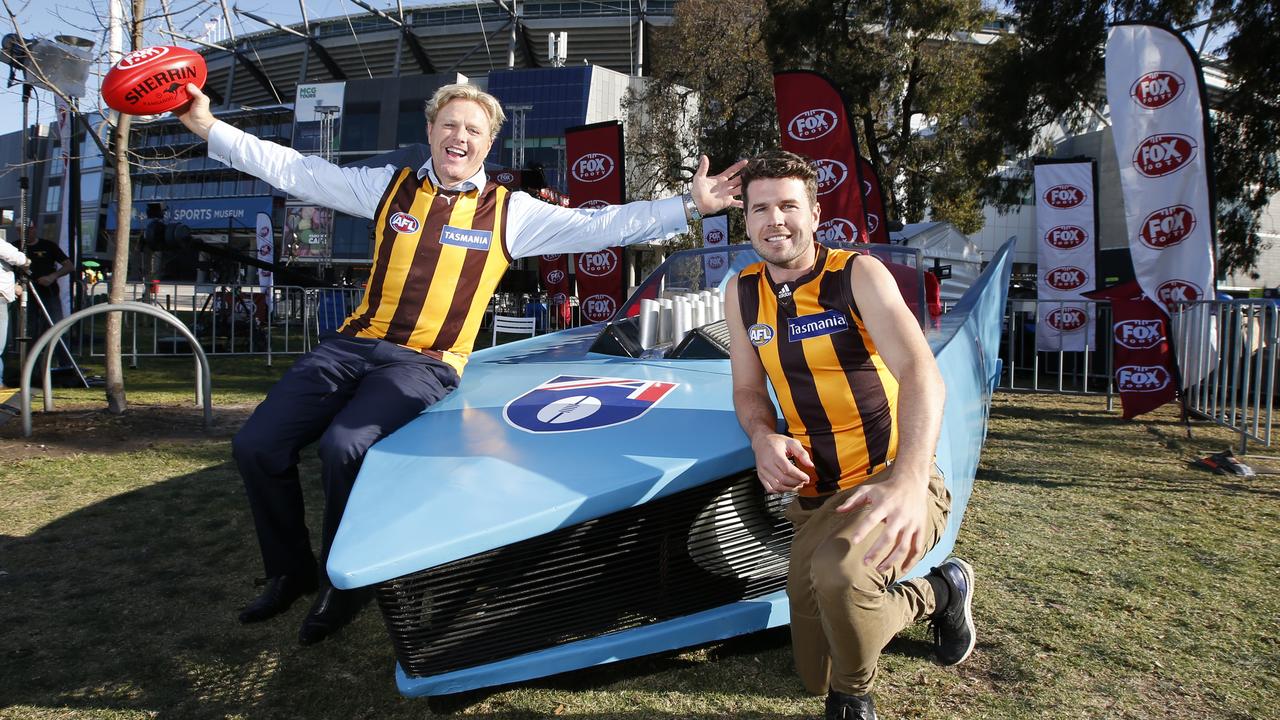 The car (nicknamed the Batmobile) that featured in the halftime entertainment of the 1991 Grand Final, seen here in front of the MCG before the 2015 AFL Grand Final with former players Dermott Brereton and Jonathan Simpkin. Picture: David Caird.