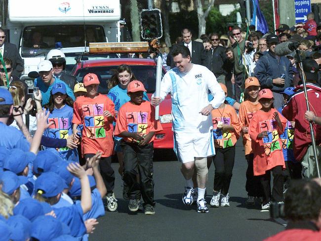 Olympic Torch Relay Day 89, Penrith to Bowral. Torchbearer and NSW Olympics Minister Michael Knight in Campbelltown on on September , 2000.