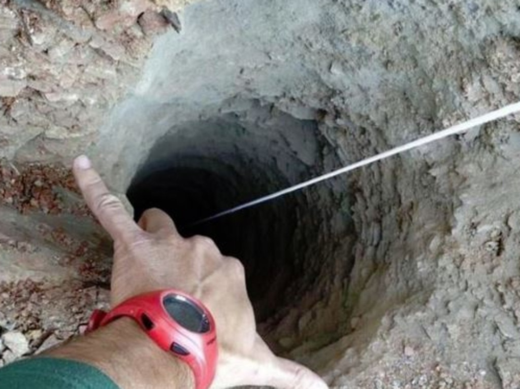 At just 25cm wide, the hole is too narrow for adults to fit down. Picture: Fire Department handout