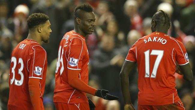 Liverpool's Mario Balotelli, center, celebrates scoring.