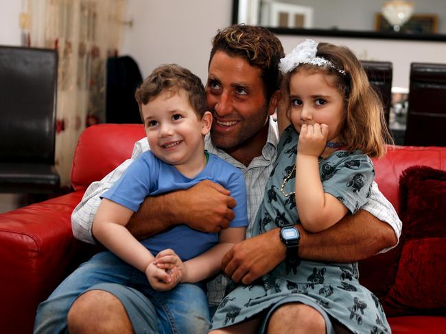 Noah and Lahela with their father Ali Elamine in their family home in Beirut. Picture: Reuters/Mohamed Azakir