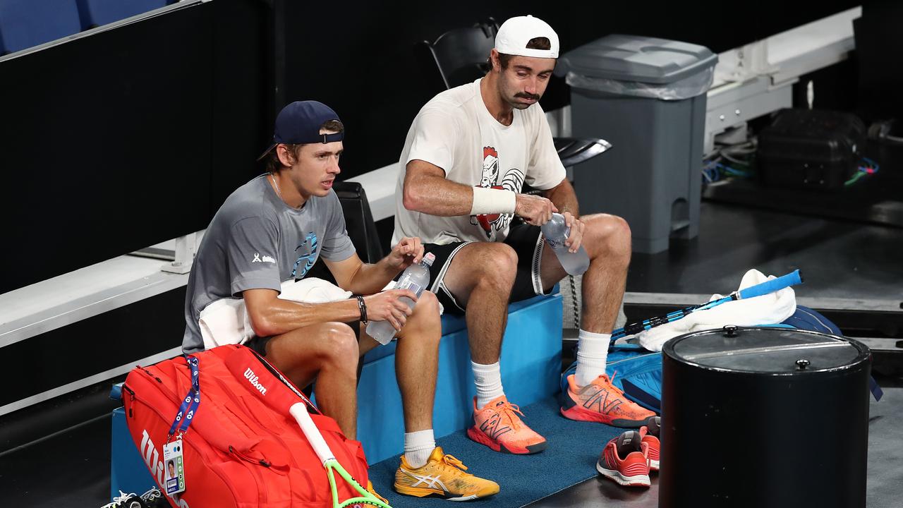 MELBOURNE, AUSTRALIA - FEBRUARY 07: Alex de Minaur of Australia sits next to Jordan Thompson of Australia during a practice session ahead of the 2021 Australian Open at Melbourne Park on February 07, 2021 in Melbourne, Australia. (Photo by Matt King/Getty Images)