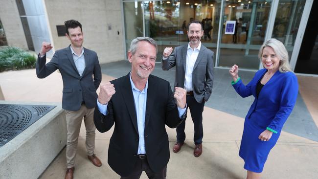 The University of Queensland COVID-19 vaccine team (left to right) Associate Professor Keith Chappell, Professor Paul Young and Professor Trent Munro with Innovation Minister Kate Jones. Photo: Annette Dew.