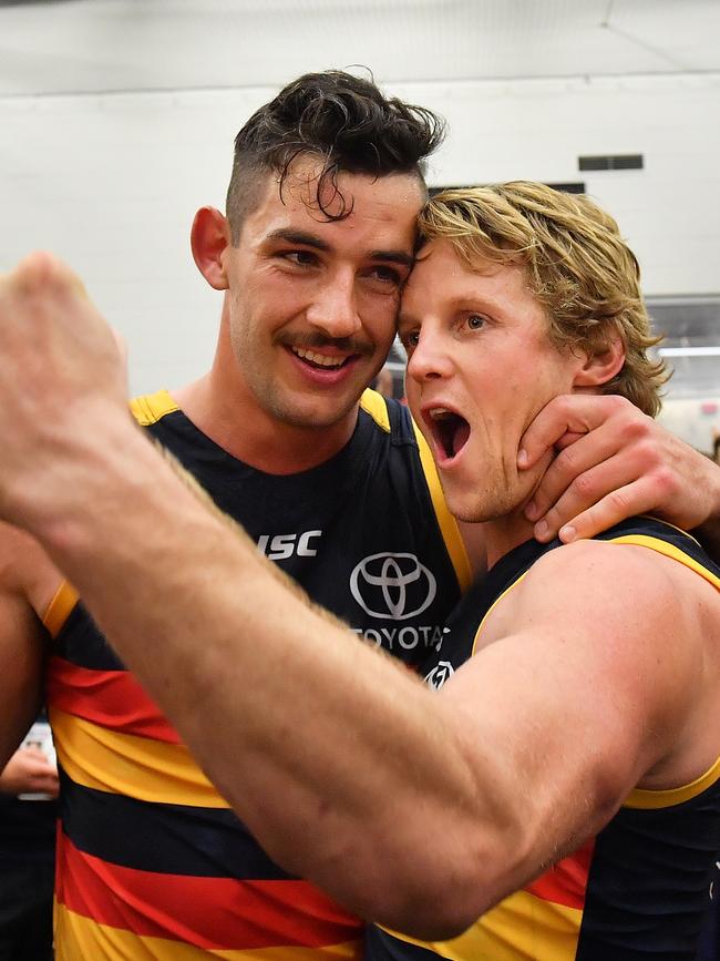 Sloane and Taylor Walker after the 2017 preliminary final win over Geelong. Picture: Daniel Kalisz/Getty Images)