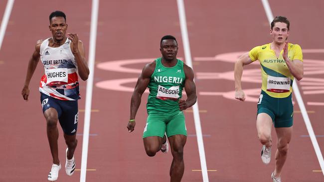 TOKYO, JAPAN - AUGUST 01: Zharnel Hughes of Team Great Britain, Enoch Adegoke of Team Nigeria and Rohan Browning of Team Australia compete Men's 100m Semi-Final on day nine of the Tokyo 2020 Olympic Games at Olympic Stadium on August 01, 2021 in Tokyo, Japan. (Photo by Michael Steele/Getty Images)