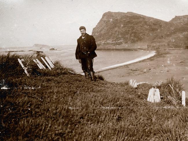 Anders Harboe-Ree standing in an old graveyard on Possession Island, Crozet Islands, 1906 or 1907. The men buried in the graveyard would have been sealers or whalers from the first half of the the nineteenth century.