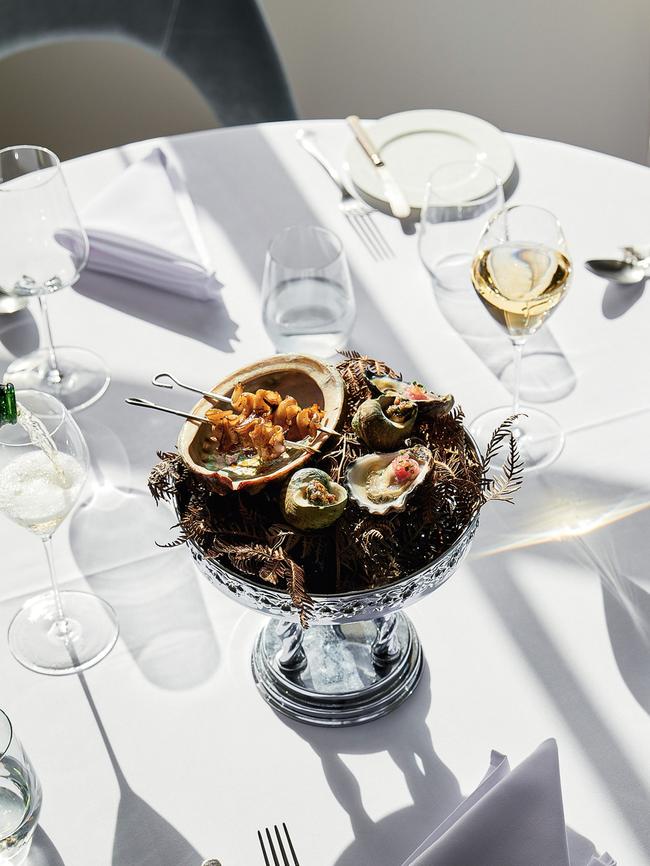 Barbecued abalone, oyster, and periwinkle with roasted almond and garlic butter at Audrey’s. Picture: Kris Paulsen & Greg Elms.