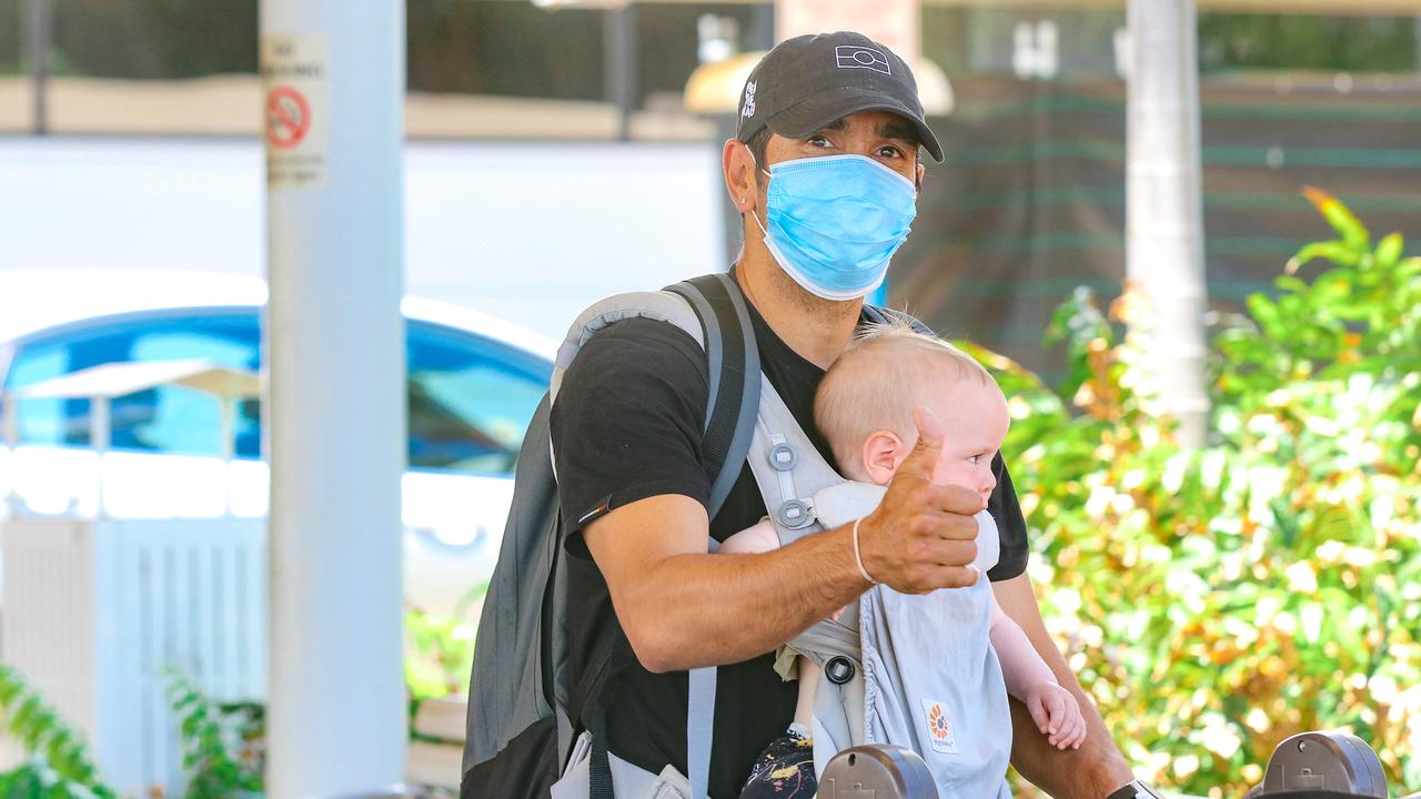 Eddie Betts and Eddie Jr en route to quarantine. Picture: Glenn Campbell