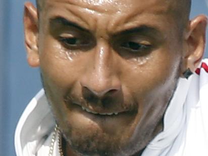 Nick Kyrgios, of Australia, returns to Richard Gasquet, of France, during a first round match at the Western & Southern Open tennis tournament, Tuesday, Aug. 18, 2015, in Mason, Ohio. (AP Photo/David Kohl)