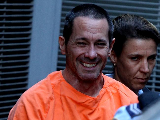 Walter Marsh smiles as he leaves court after being sentenced to life in prison.