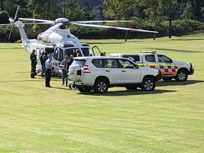 The zookeeper is loaded onto a helictoper to be taken to hospital. Picture: Sam Strong