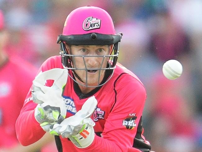 SYDNEY, AUSTRALIA - DECEMBER 23: Peter Nevill of the Sixers catches the ball during the Big Bash League match between the Sydney Sixers and the Perth Scorcher at Sydney Cricket Ground on December 23, 2017 in Sydney, Australia.  (Photo by Brett Hemmings/Getty Images)